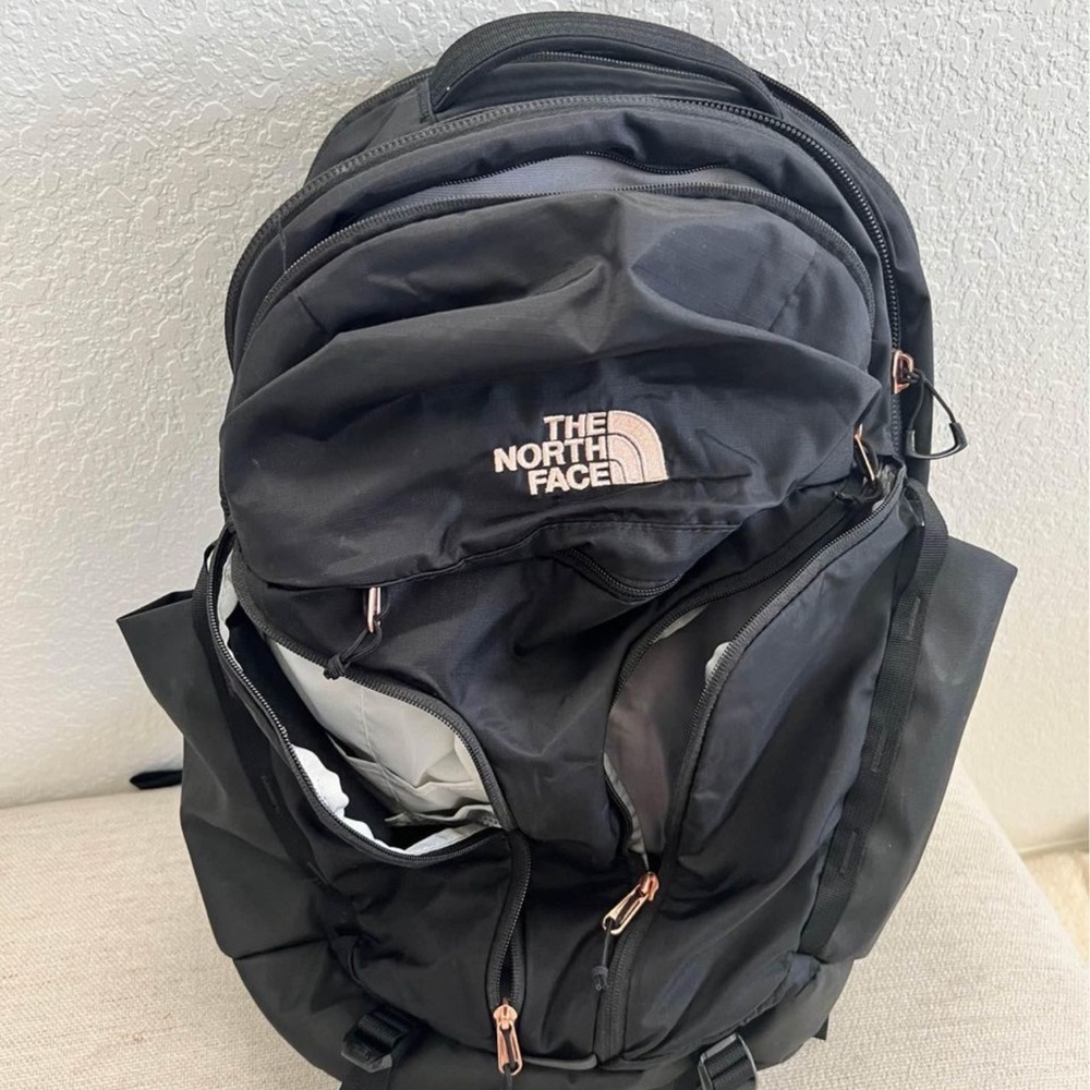 North Face backpack with rose gold stitching and finishes